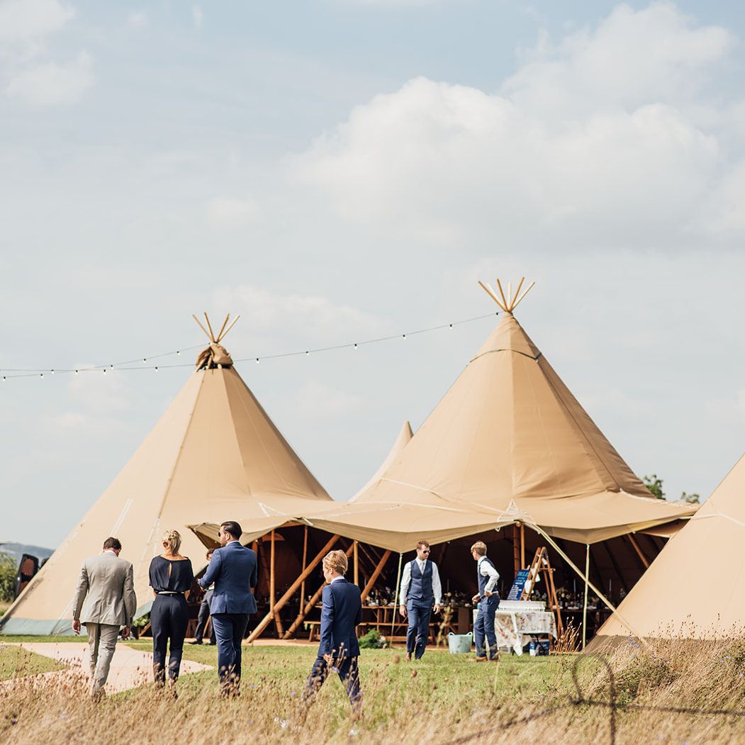 Guests arriving at wedding tipis